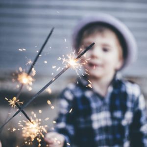 sparkler with child in back